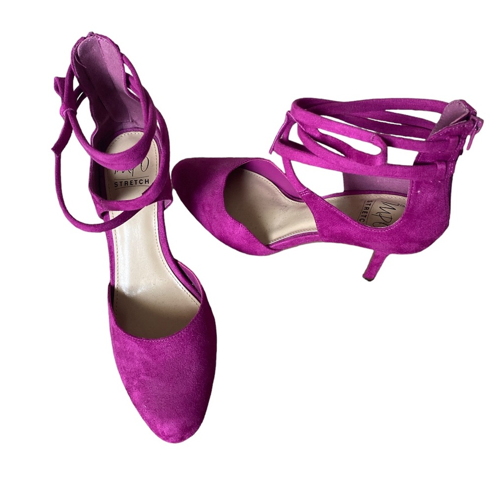 Fuschia closed in heels zipper located on the back of shoes. Never worn